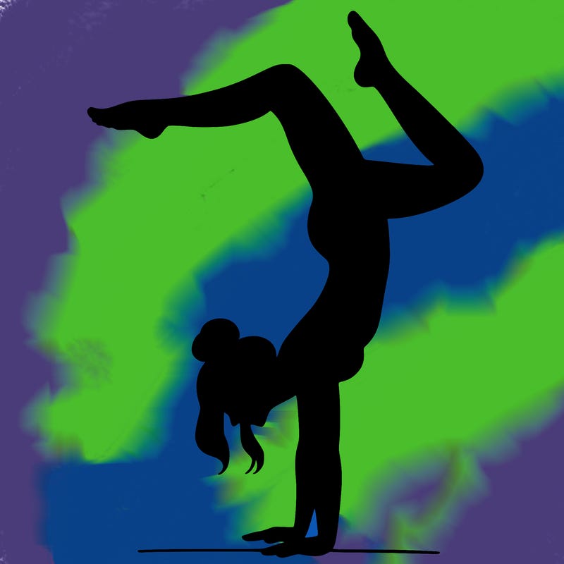 a woman doing a handstand