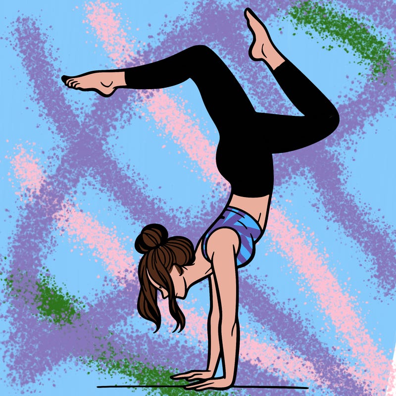 a woman doing a handstand
