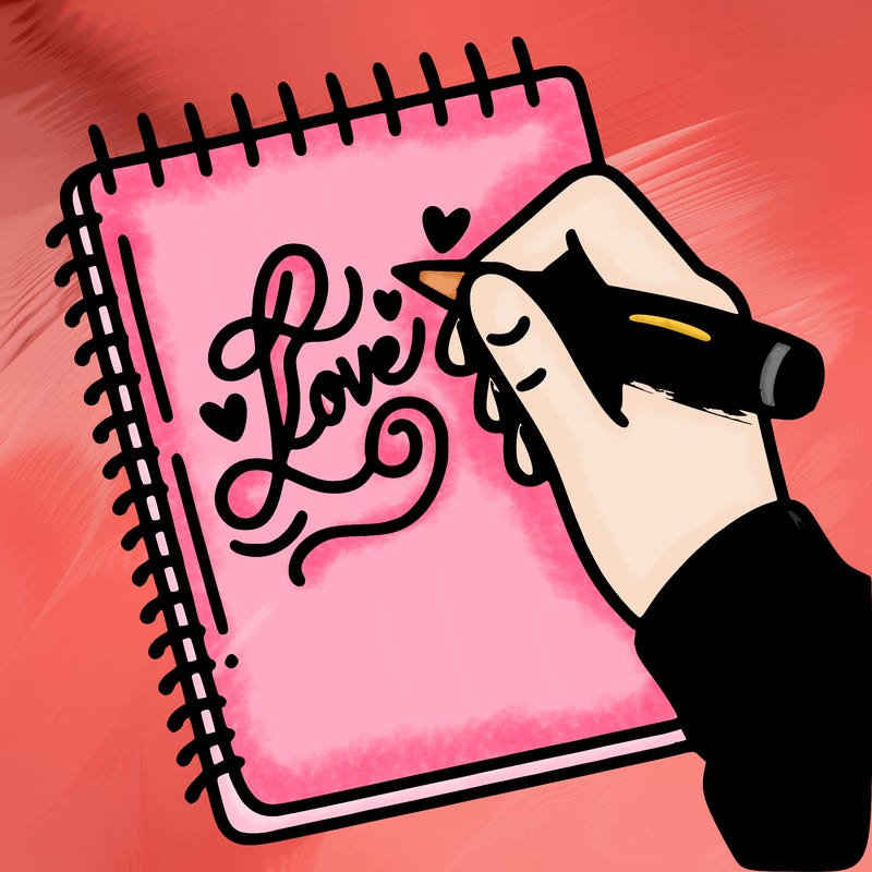 a hand writing “love” in calligraphy on a notebook