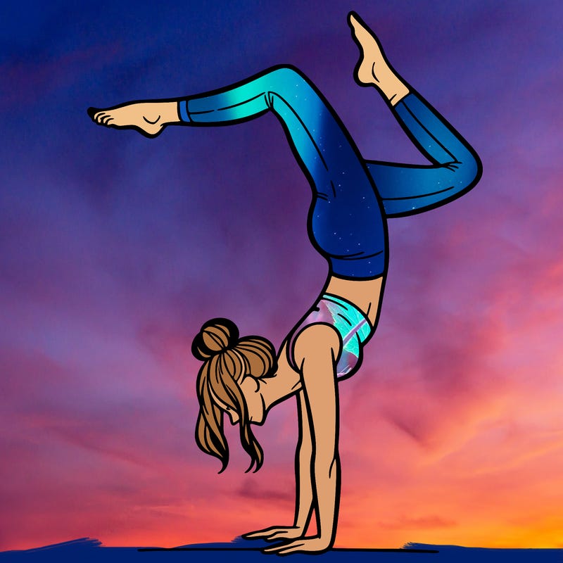 a woman doing a handstand