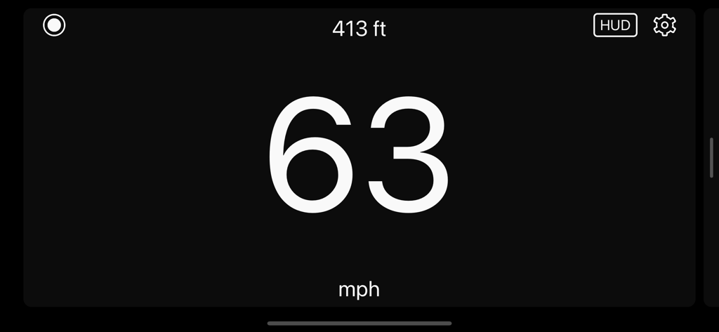 Digital speedometer showing 63 mph in a large font on a black background with HUD and settings icons