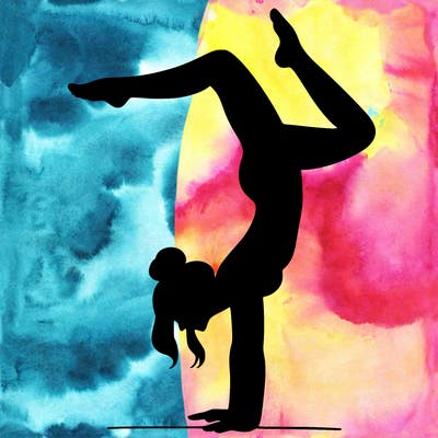 a woman doing a handstand