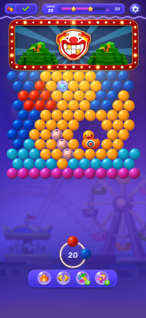 Bubble Shooter - POP Frenzy - Bubble Shooter POP Frenzy Handyspiel Level zeigt bunte Blasen und ein Gummientchen-Ziel in einer Jahrmarkt-Kulisse.