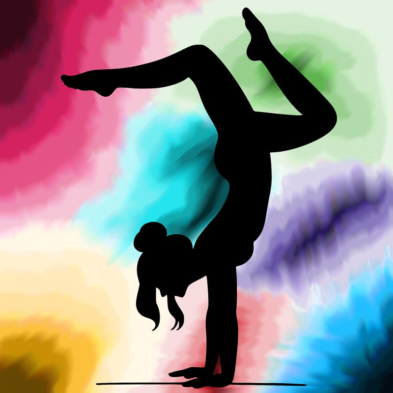 a woman doing a handstand