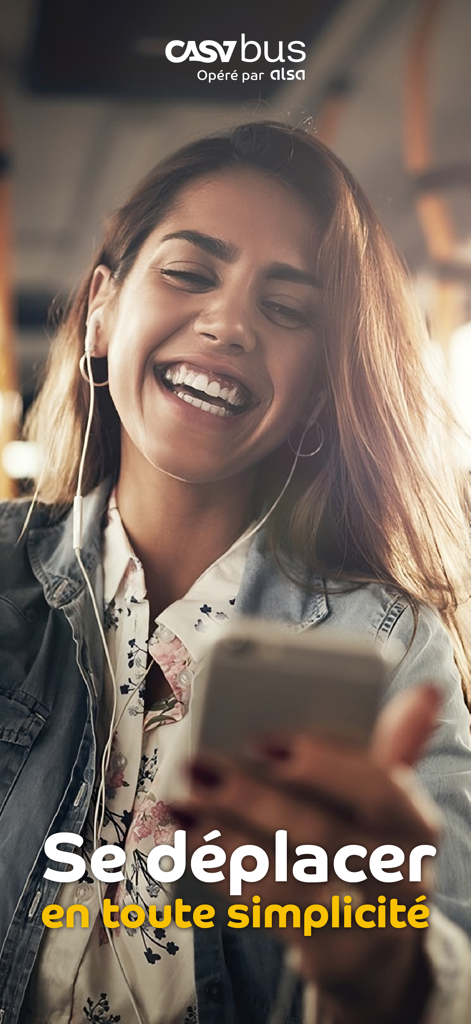 CASABUS - A young woman smiling while using her smartphone on a bus with the Casabus logo