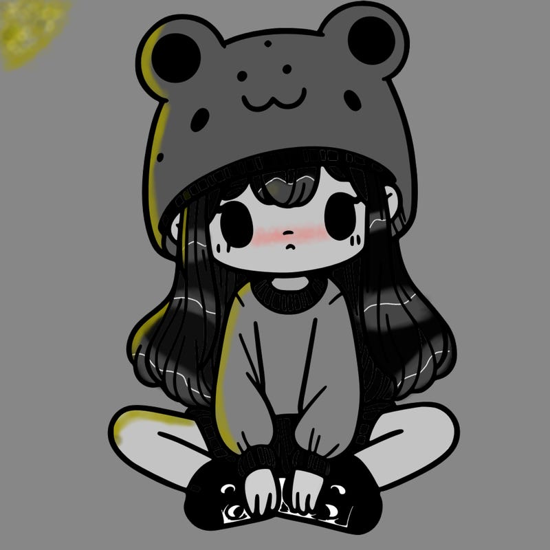 a girl wearing a frog hat and some frog socks