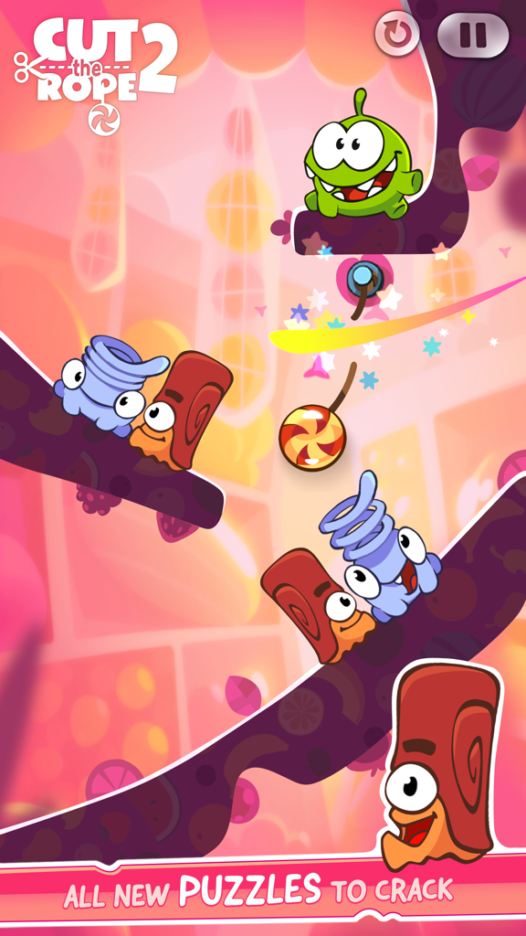 Om Nom y los nuevos personajes Nommies en un colorido nivel de puzle de Cut the Rope 2