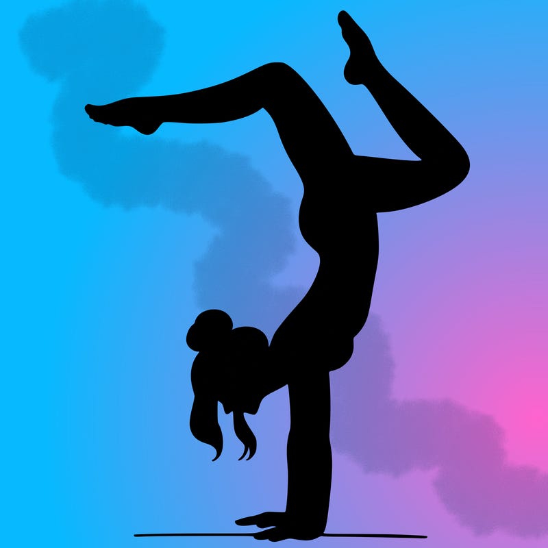 a woman doing a handstand