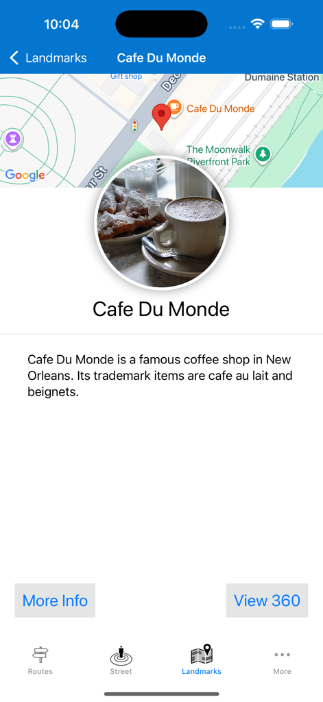 Remote Walk: Virtual Walking - Information screen for the Cafe Du Monde landmark in New Orleans within the Remote Walk app