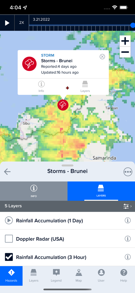 Disaster Alert (PDC Global) - The Disaster Alert app displaying a storm hazard notification on an interactive map with rainfall accumulation data layers.