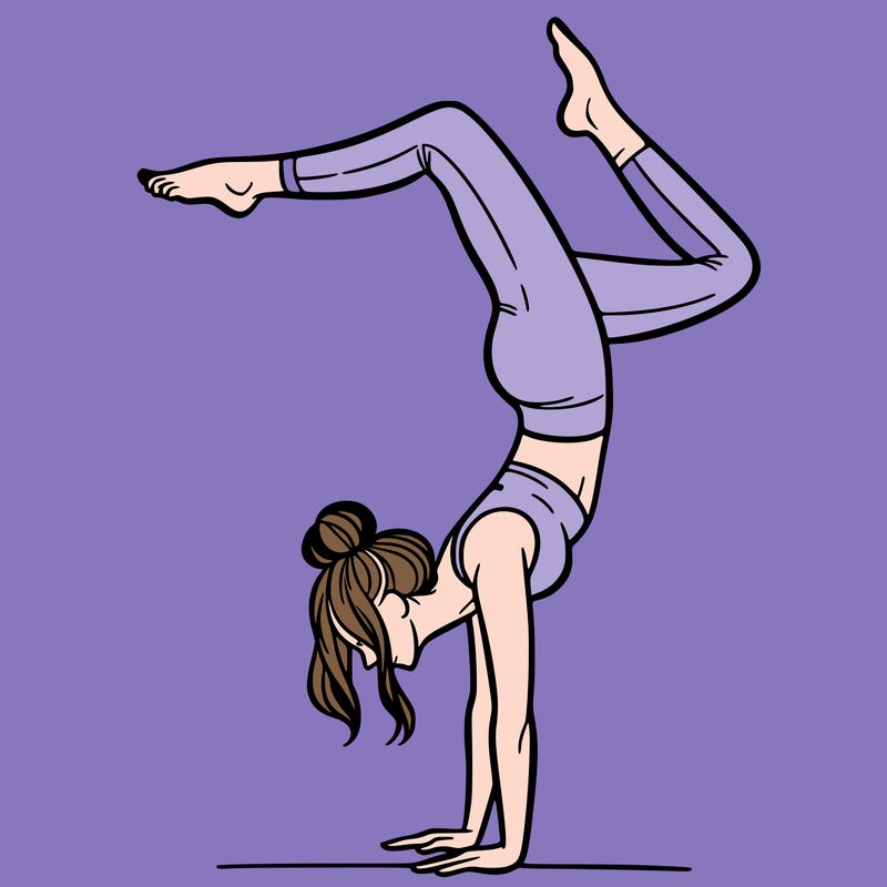 a woman doing a handstand