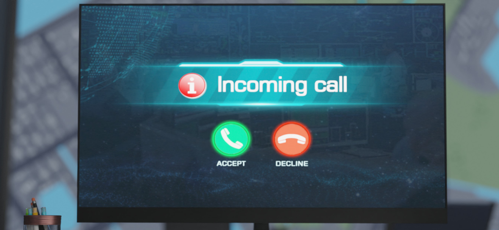 A computer monitor showing an incoming 911 emergency call interface with accept and decline buttons
