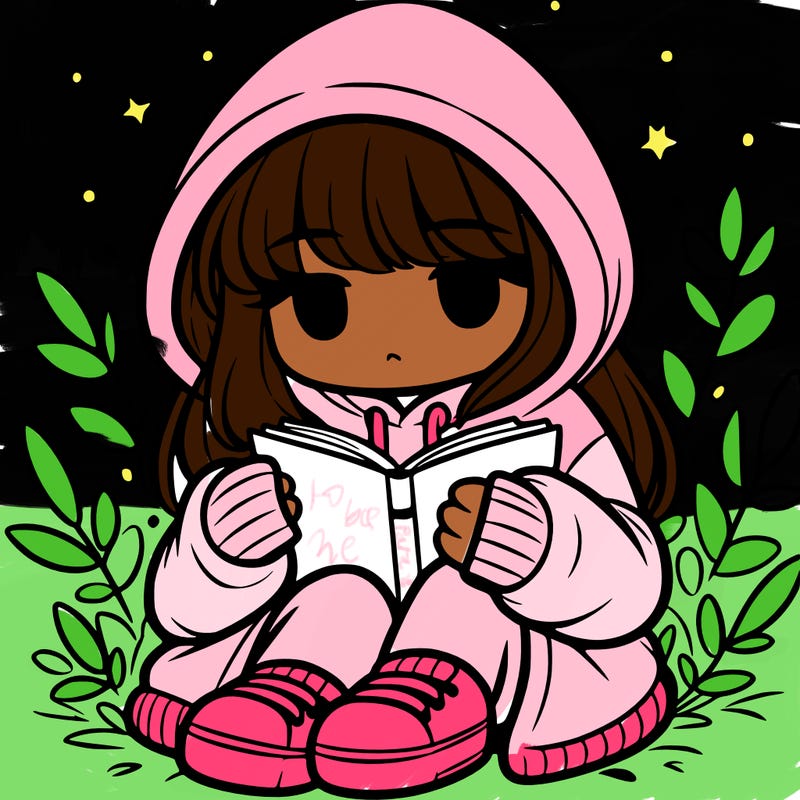 girl in oversized hoodie reading a book