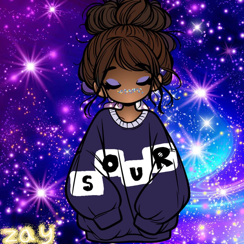 girl with baggy sweatshirt and messy bun