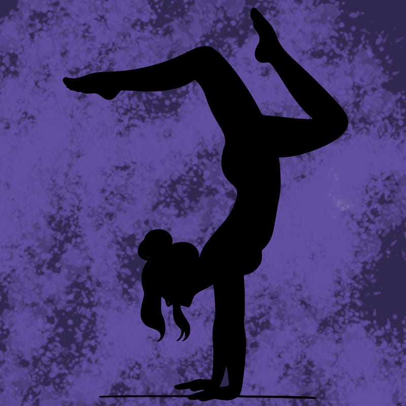 a woman doing a handstand