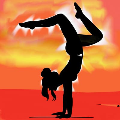 a woman doing a handstand