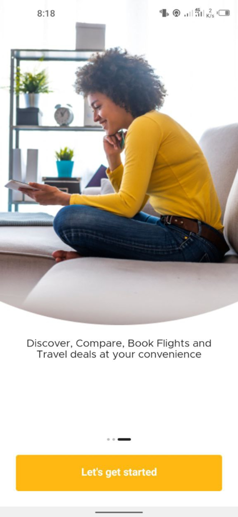 Travelbeta - A woman sitting on a couch using the Travelbeta app to book flights and travel deals