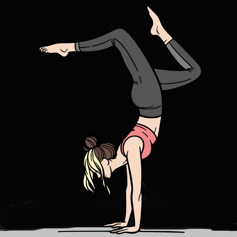 a woman doing a handstand