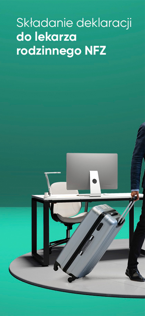 A business professional with a suitcase walking past an office desk