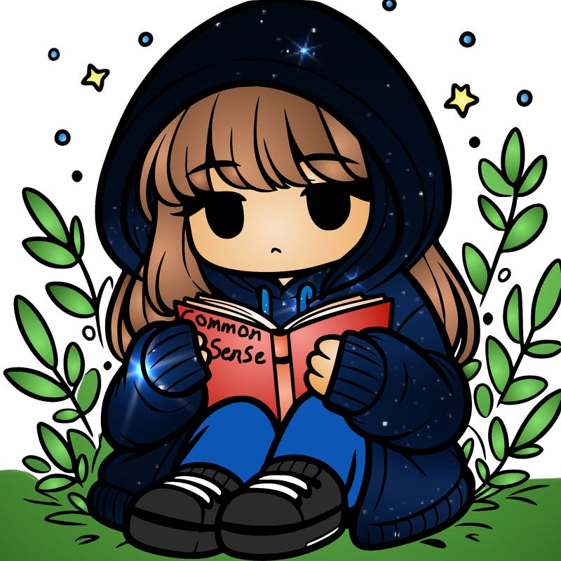 girl in oversized hoodie reading a book