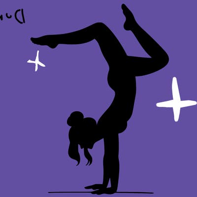 a woman doing a handstand