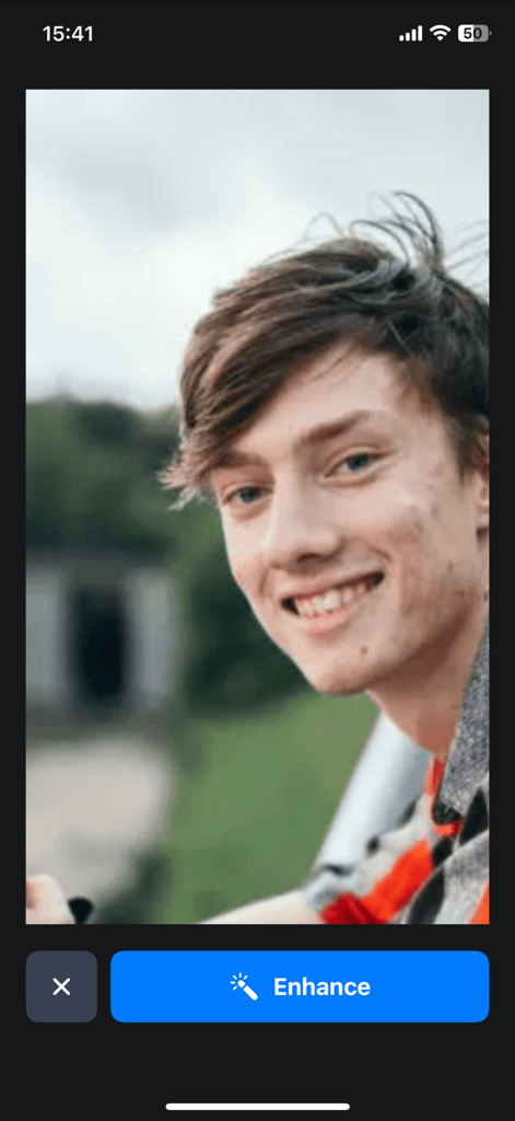 Photo Quality Enhancer FaceFix - A portrait of a young man with skin blemishes in the FaceFix app interface featuring an Enhance button.