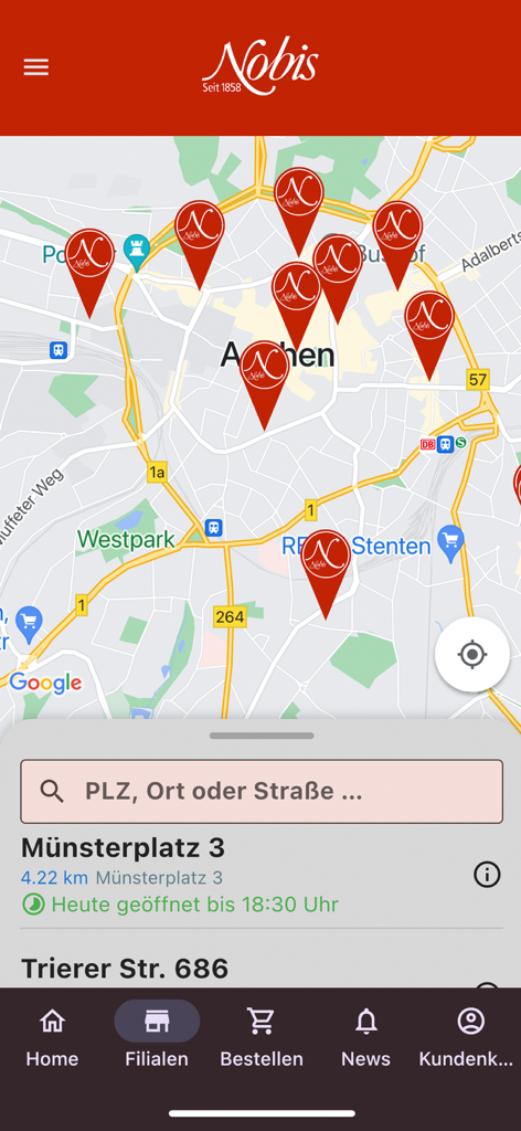 Nobis Printen - The store locator screen of the Nobis Printen app showing bakery branches on a map of Aachen Germany.