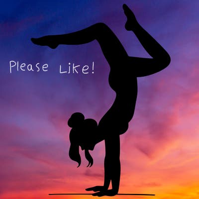 a woman doing a handstand