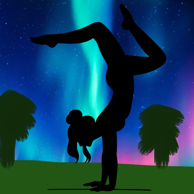 a woman doing a handstand