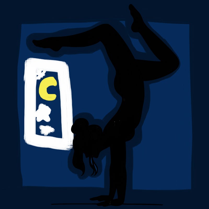 a woman doing a handstand