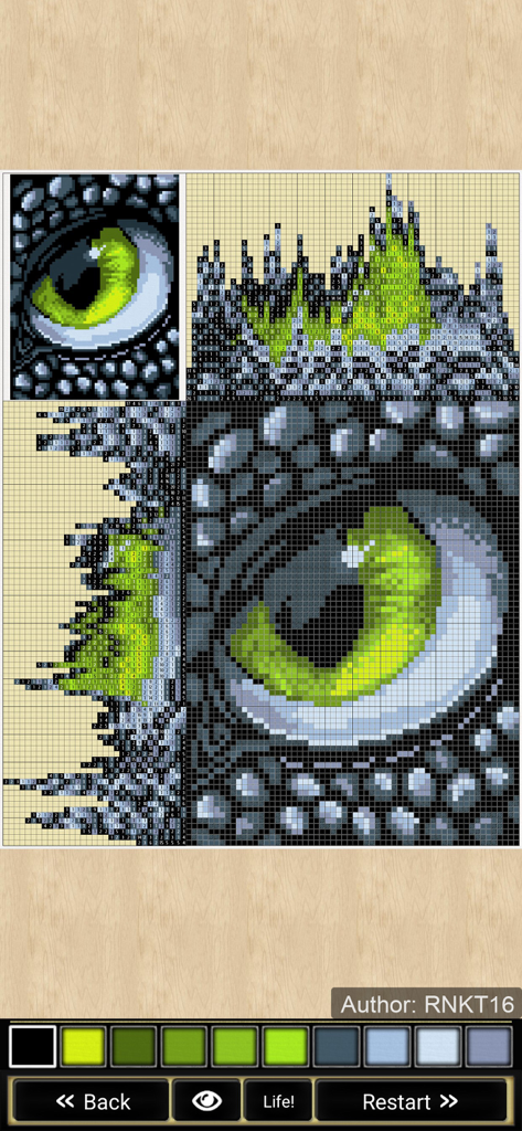Nonograms Katana - ノノグラム・カタナアプリ内の、精巧なドラゴンの目を描いた完成済みカラーノノグラムパズル。