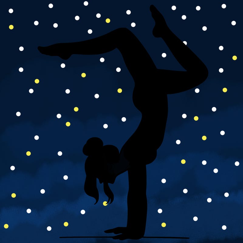 a woman doing a handstand