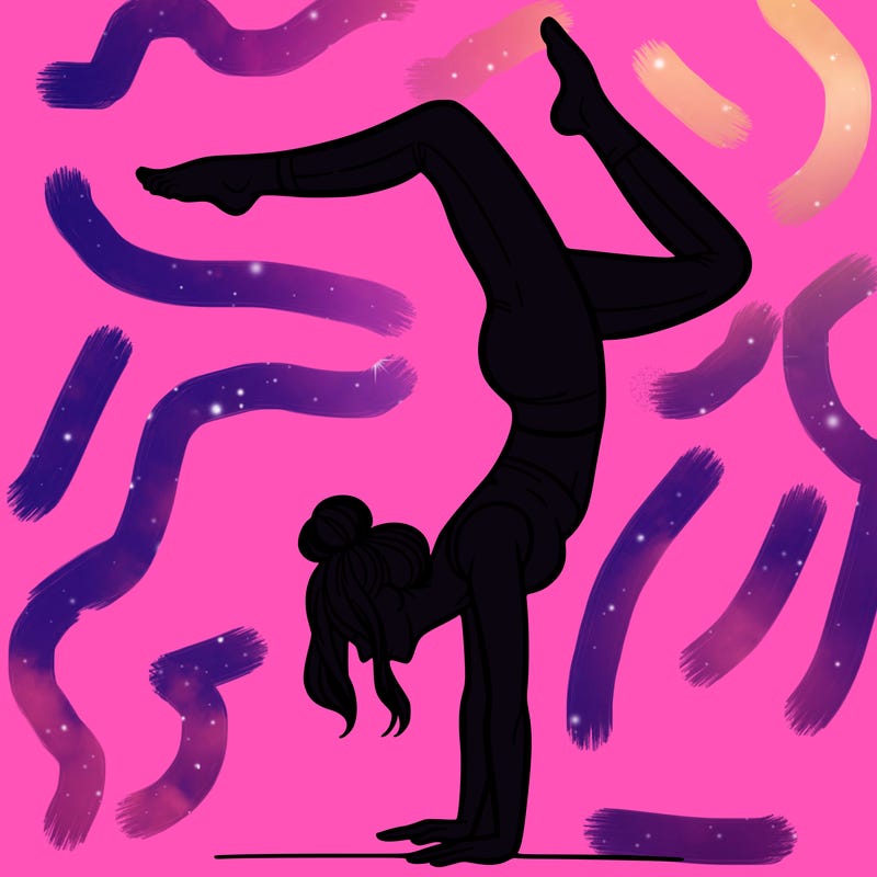 a woman doing a handstand