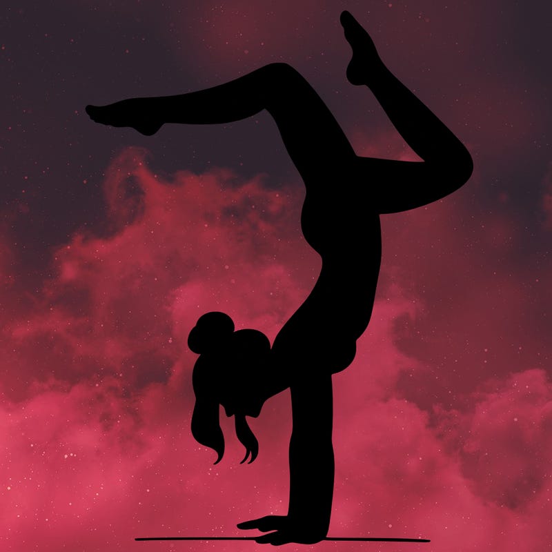 a woman doing a handstand