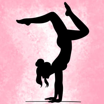 a woman doing a handstand