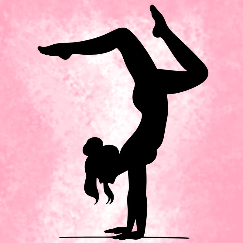 a woman doing a handstand