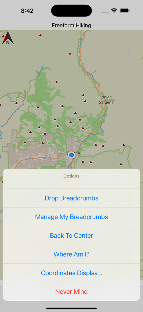 Sedona Hiking app map interface showing freeform hiking mode with a navigation menu for dropping breadcrumbs and checking current location coordinates