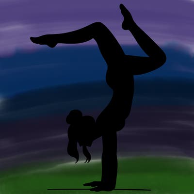 a woman doing a handstand