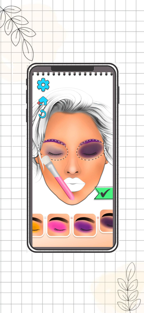 Un pincel de maquillaje digital aplicando sombra de ojos morada a una cartilla facial en la pantalla de un smartphone móvil