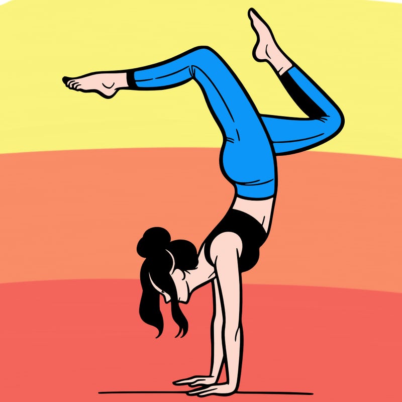 a woman doing a handstand