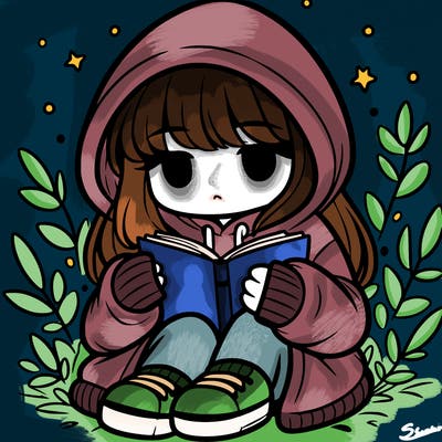 girl in oversized hoodie reading a book