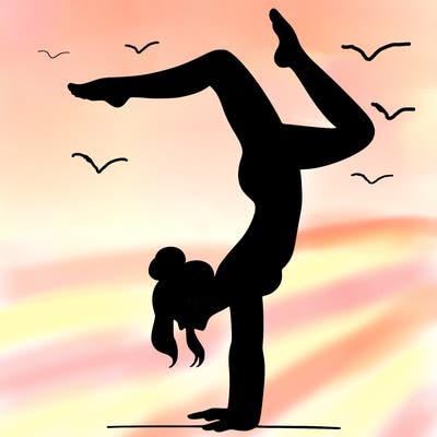 a woman doing a handstand