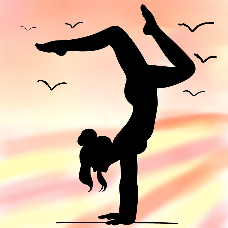 a woman doing a handstand