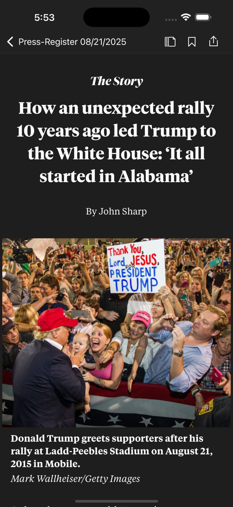 The Press-Register - A news article within The Press-Register app about a political rally in Mobile Alabama