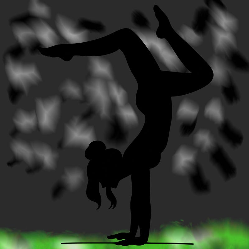 a woman doing a handstand