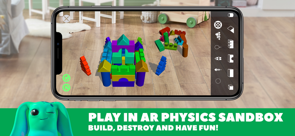 A colorful digital castle built in an augmented reality physics sandbox using the DEVAR app on a wooden floor