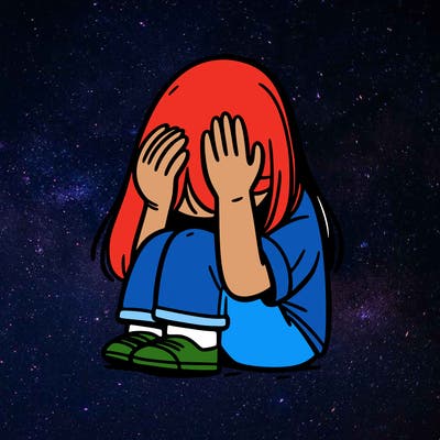 girl sitting down covering her head