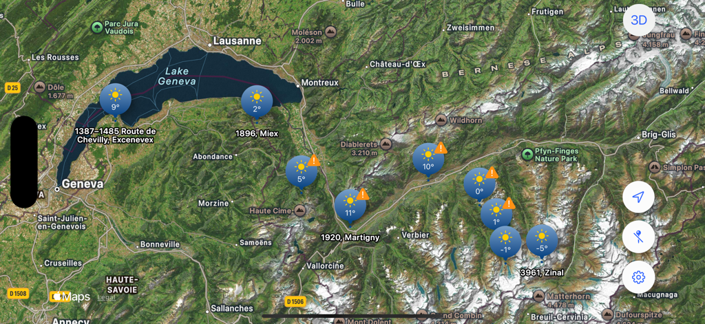 Tap Weather - 山岳地帯全体に気温と太陽のアイコンが付いた天気ピンが表示されている衛星マップ