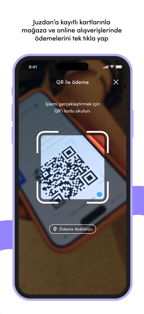 Interfaz de la aplicación móvil Juzdan mostrando un escáner de código QR para pagos digitales seguros en tiendas