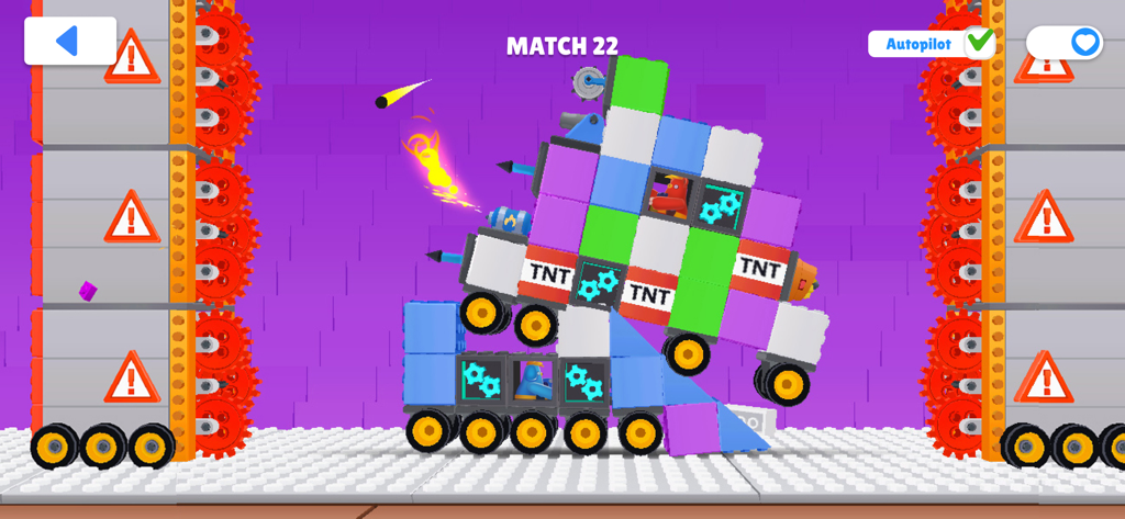 Two custom toy block vehicles battling in an arena with saws and TNT blocks
